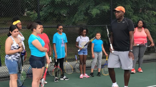 Retired tennis professional and Director of Tennis for GNTE, Bob Bynum with players during one of the summer sessions. Retired tennis professional and Director of Tennis for GNTE, Bob Bynum with players during one of the summer sessions.