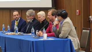 panelists answering questions and addressing 