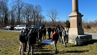 Photo of Seton Hall’s Pirate Battalion at the site of the New Jersey Army National Guard BrigadePhoto of CDT Thomas Kachler explaining fire and maneuver to Seton Hall’s Pirate BattalionPhoto of Pirate Battalion cadets discussing the tactical decisions of General Burnside and McClellan