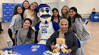 Photo of the Pirate posing with seniors at the annual Last 56 Days event.