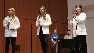 College of Nursing freshman, Allison Lamoureux, Katie Mazzarelli, and Anne Marie Ryan at Pirates Pitch