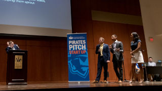 Alissa Lopez at Pirate PitchSpeakers discussing on stage at the Pirates Pitch convention
