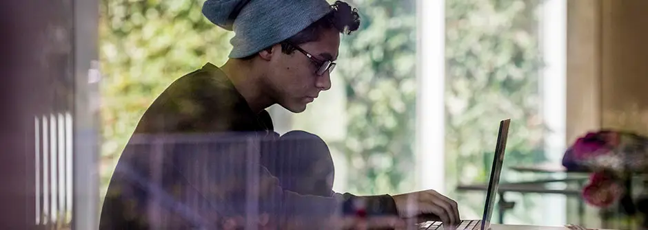 Student on computer taking online course