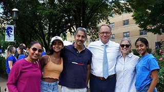 President Nyre with a Class of 2026 family on Move-In Day.