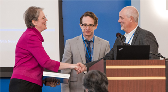 Associate Professor of Political Science &amp; Public Affairs Matthew Hale, who also serves as the president of the NJBDA, and Professor Minimair greet Keynote Speaker Kjersten Moody, Prudential Financial’s Chief Data Officer.