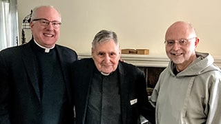 Reverend Monsignor Joseph R. Reilly, Dean, ICSST (left), Monsignor James Turro (middle) and Rev. Mariusz Eugene Koch (right) celebrate Msgr. Turro’s birthday during a lunch.