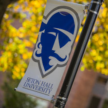 Seton Hall Pirate logo banner with orange leaves in the background