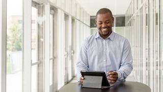 Seton Hall Graduate Student on computer