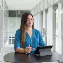 SHU female Graduate student working on a laptop