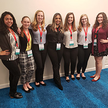 A group photo of Speech Language Pathology students at a conference.