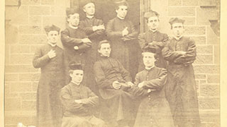 Seminarians on the Chapel Steps 1870s. Seminarians on the chapel steps; unidentified professor in middle. - AAN