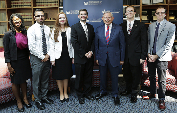 Senator Menendez with Diplomacy Student, Photo Credit: Michael Paras.