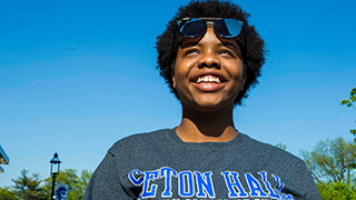 Seton Hall student wearing a Stillman School of Business sweatshirt
