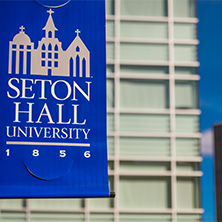 SetonHallFlagBannerx222 Seton Hall banner hanging from pole x222