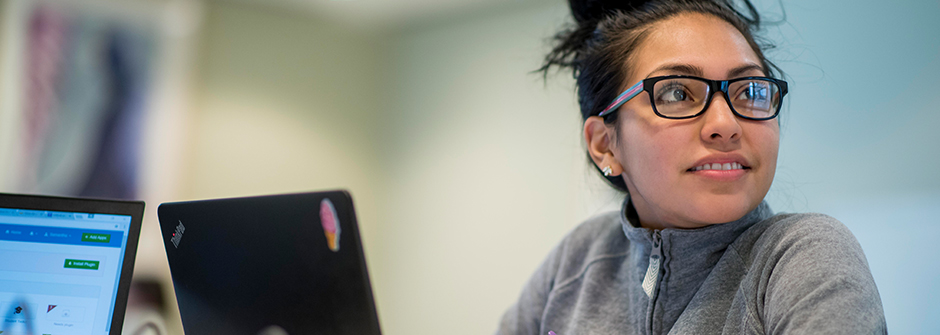 Seton Hall student, reviewing in a study room.