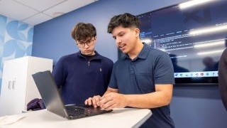 Students working with technology in classroom