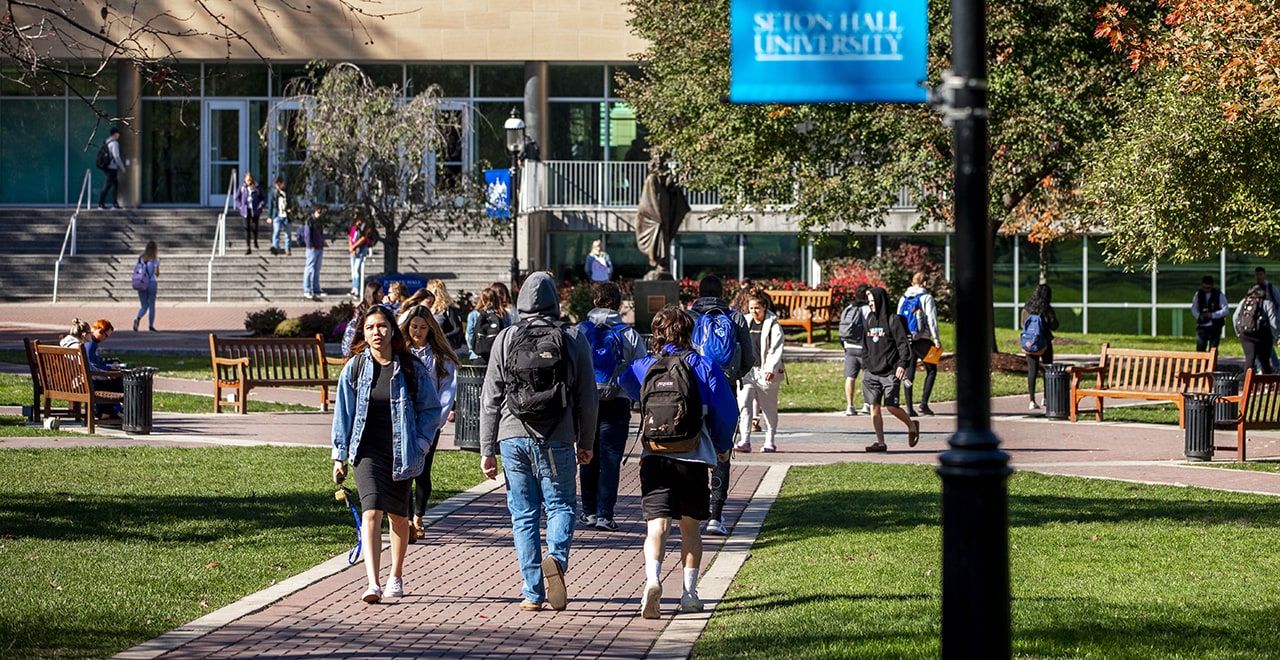 Students walking on campus near Jubilee Hall