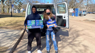 dove students unloading the van of supplies