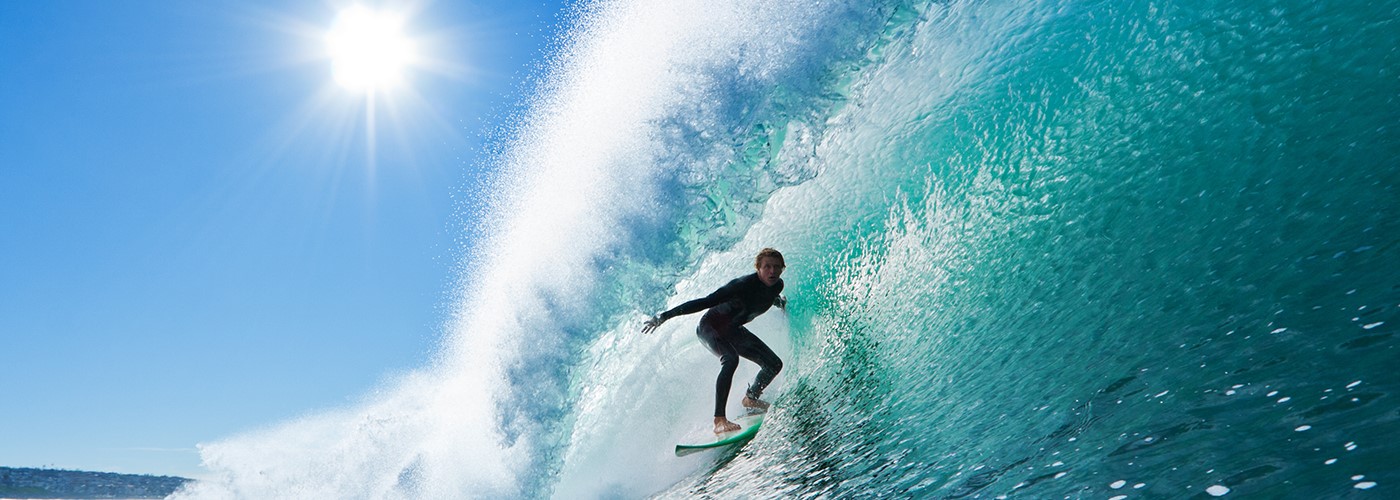 Surfer riding waves on the ocean