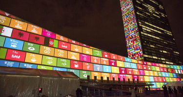 United Nations building lit up.