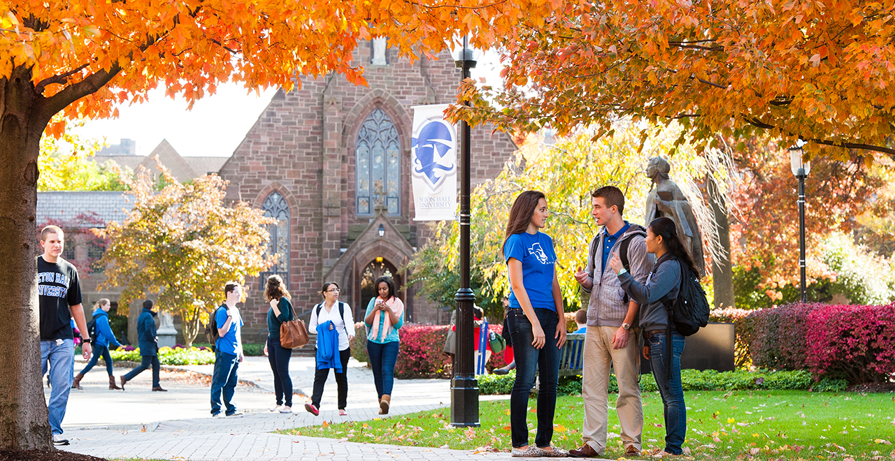 Students on the Seton Hall campus during a Fall day.
