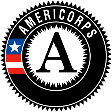 The front of McQuaid HallAmericorps logo of an 