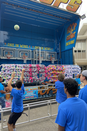 Students shooting hoops at the Blue Day celebration.