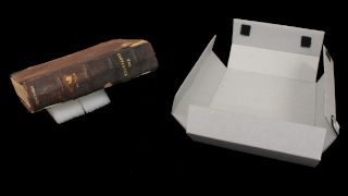 a book with a box in a black background