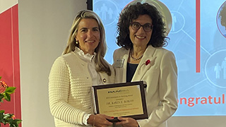 Professor Karen Boroff receives an award.