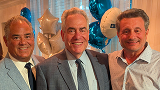 From left to right: Marc Calello ’89, Dean Ronald Weich, and John Chiaia ’93