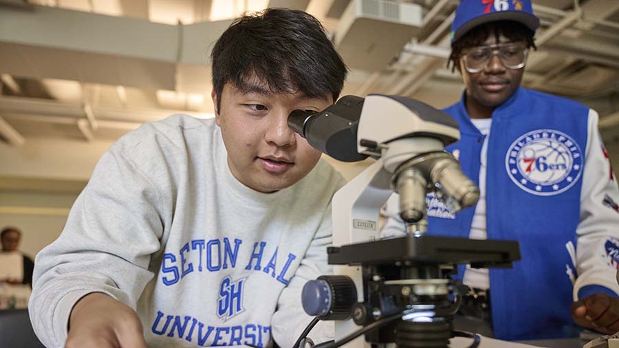 Seton Hall students working in a science lab.
