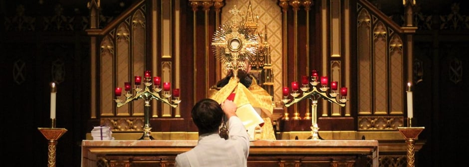 Photo of Man in Chapel with Candles