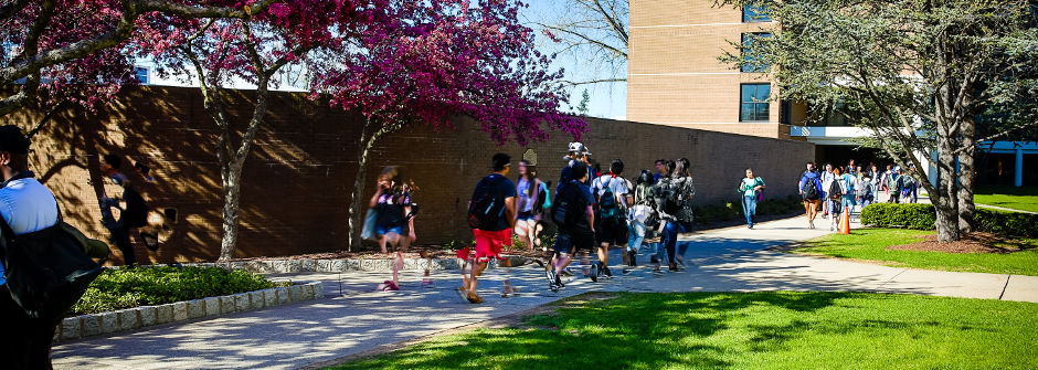 Students walking outside of Xavier Hall. 