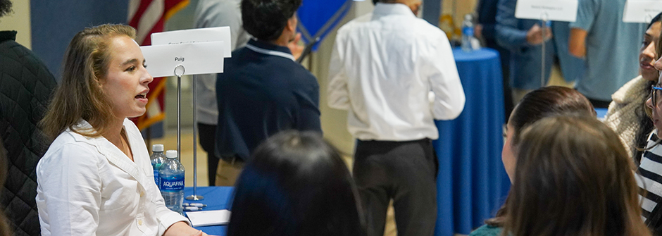 Speaker at the Career and Internship fair speaking to students. 
