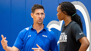 Carr speaking individually with a student