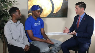 Photo of Clayton Collier performing an interview