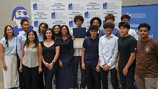 High school students receiving certificate