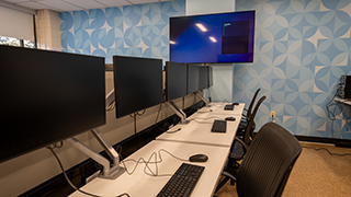 Row of monitors in the cybersecurity lab. 