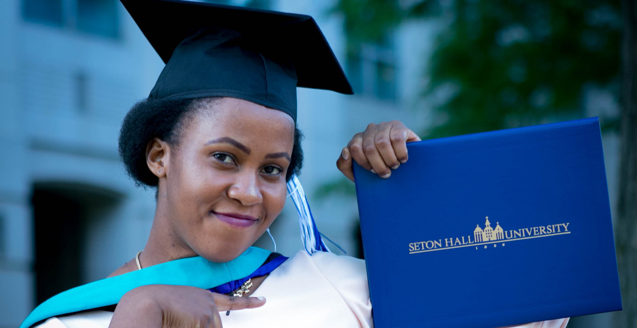 Daphine Nakiberu with diploma