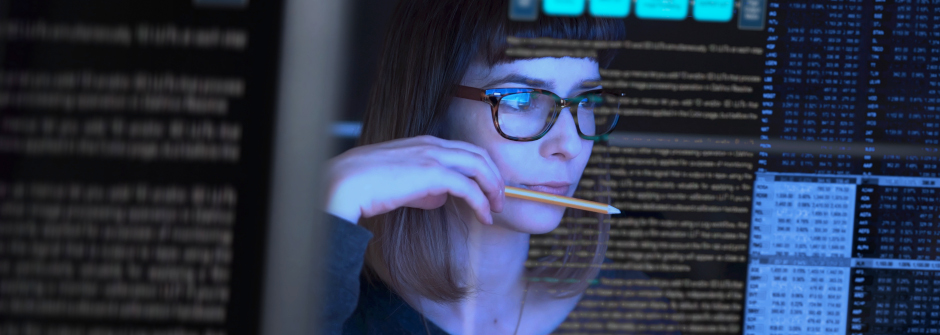 A photo of a woman holding a pencil