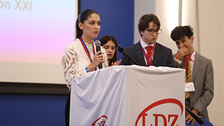 Student Speaking at Podium