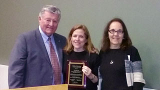 Lisa DeLuca (middle) receives her award from Patrick Brannigan, NJ ASPA president, and Roseanne Mirabella.