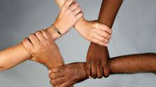 Hands of different races joining together