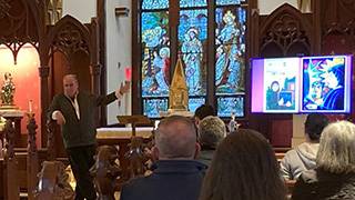 Brother Mickey McGrath, OSFS, describing his works.