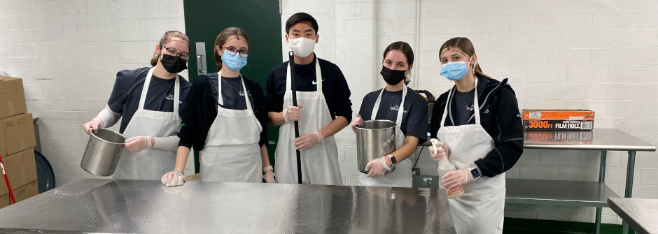 A group of students with Aprons