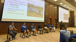 Students participate in a panel.