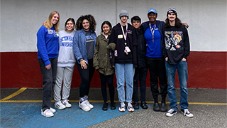 student volunteers at st. francis in posing