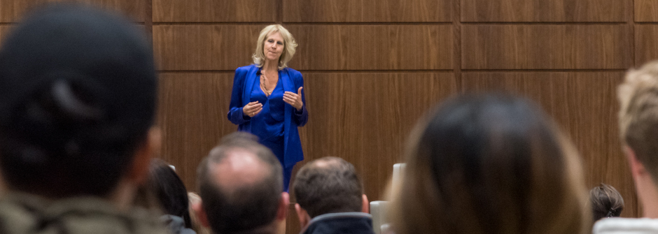 Debbie Joffe Ellis speaking to a group of people during a presentation.