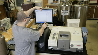 Student in a lab on a computer. 