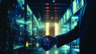 A photo of a person shaking hands with a digital arm.